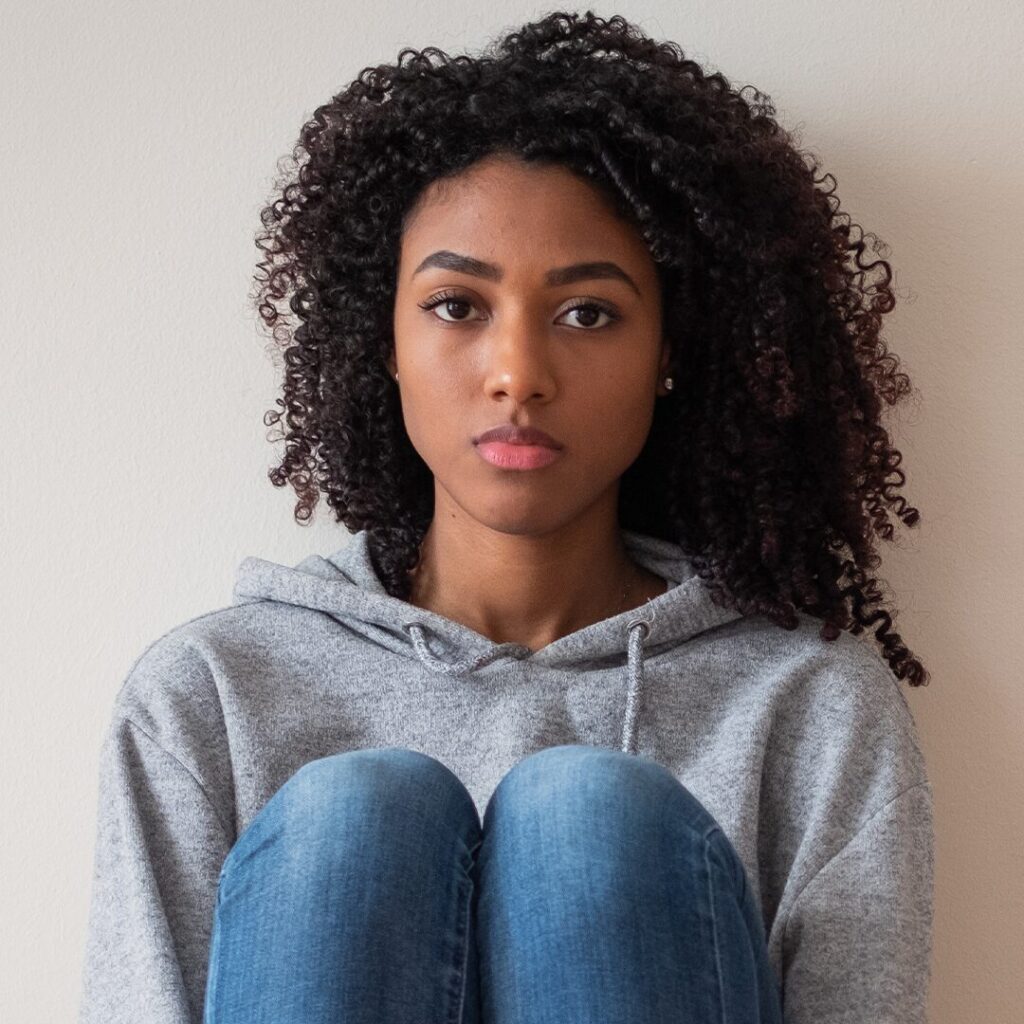 Young woman after telling her parents she's pregnant